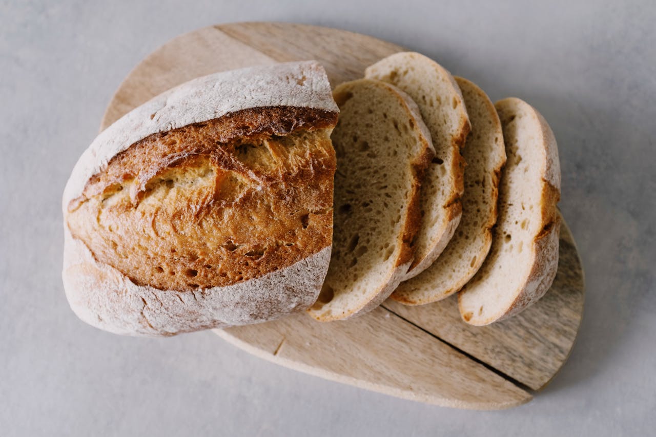 Sliced Bread On Brown Wooden Chopping Board